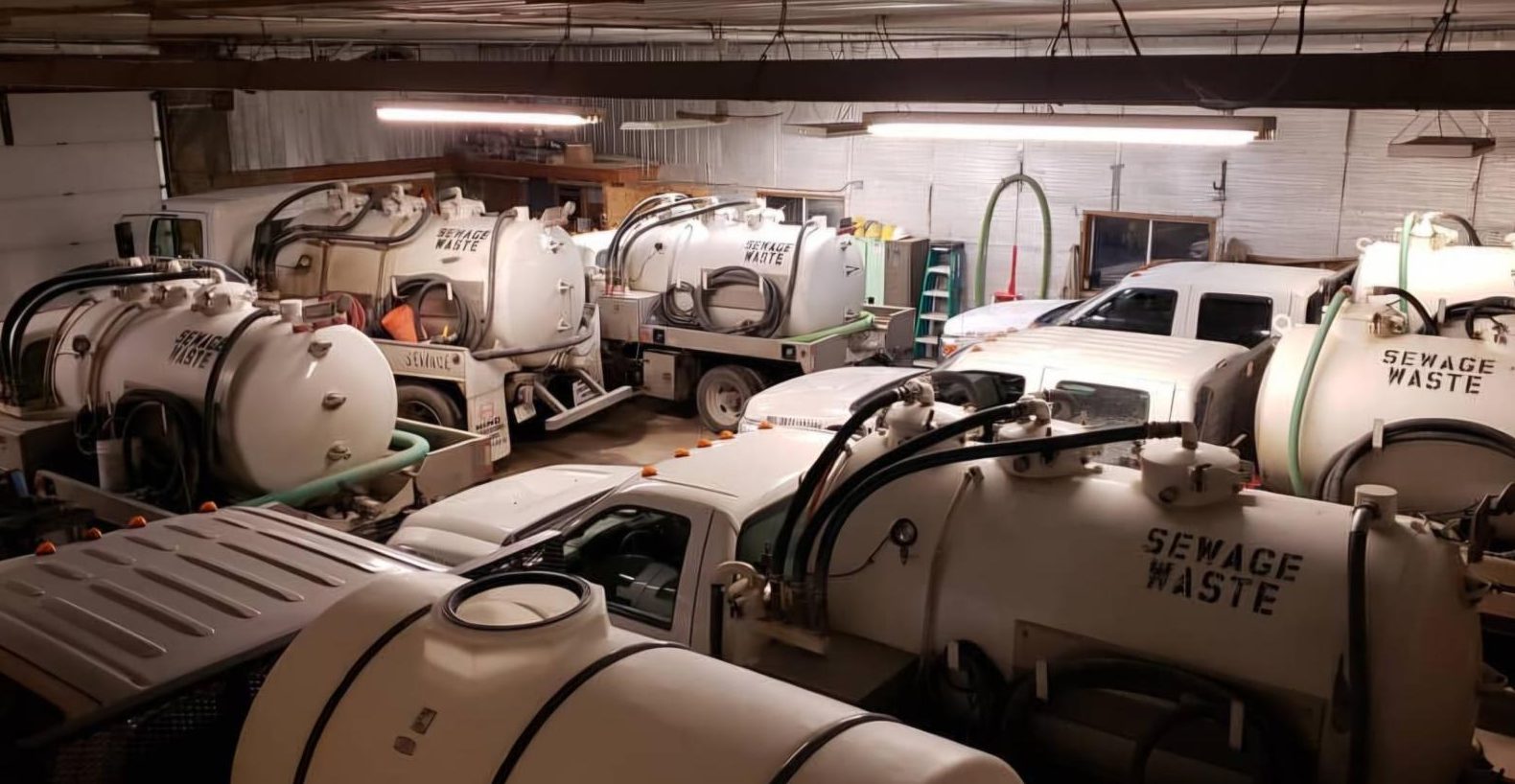 The Gee Wizz vacuum service fleet parked in the garage