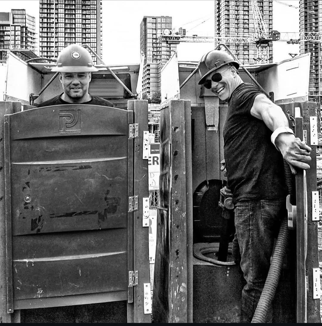 Gregory and Anthony Trentadue, owners of Gee~Wizz Portable Toilets, on a downtown Toronto construction site