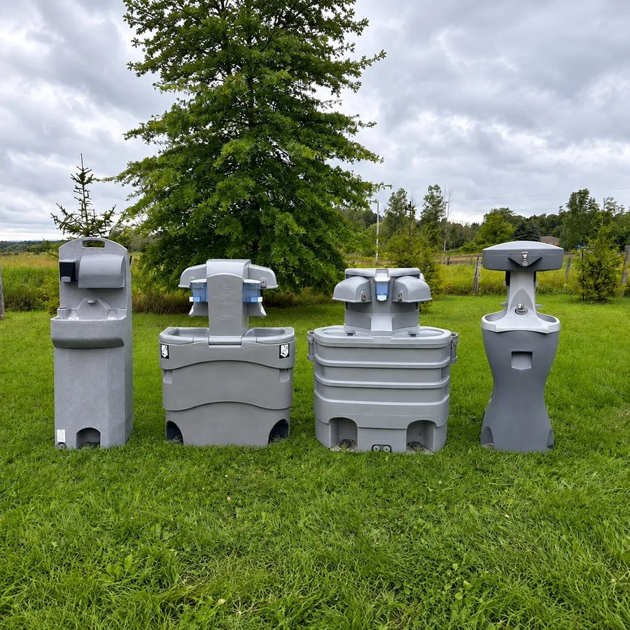 Lineup of four portable hand wash station models