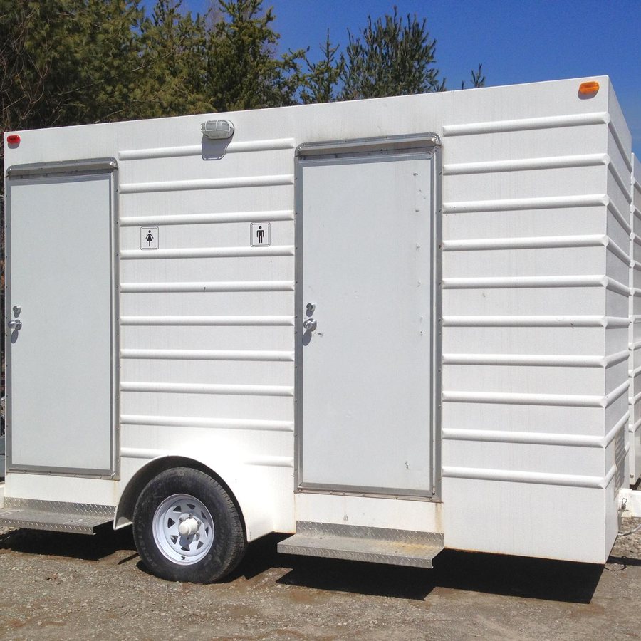 Self-contained washroom trailer with separate women's and men's doors